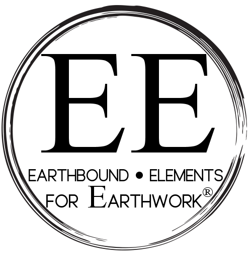 Black circular object with concentric rings on a black background.