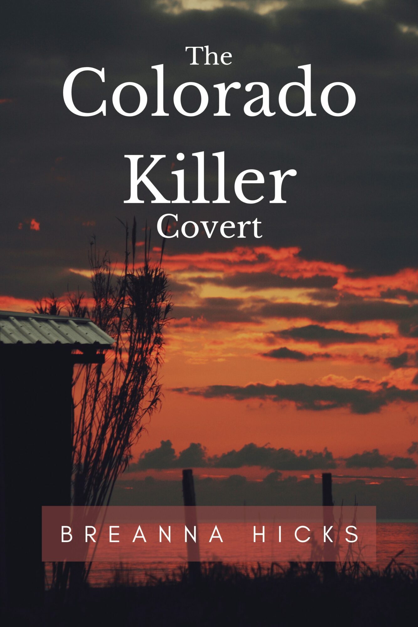Book cover with a sunset sky, silhouette of a tree and a fence, title 'The Colorado Killer Covert' and author 'Breanna Hicks'.