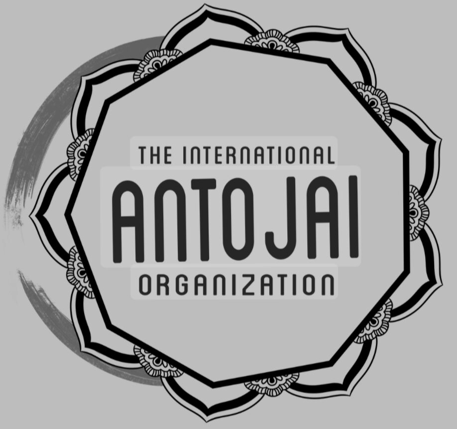 Logo with text 'The International Antojai Organization' inside a decorative geometric design, black and white, on gray background.