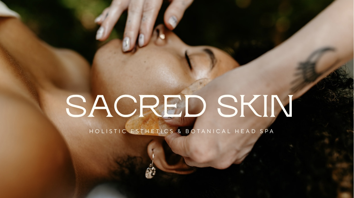 A person receiving a facial treatment with hands on their face, promoting holistic skincare and botanical therapies.