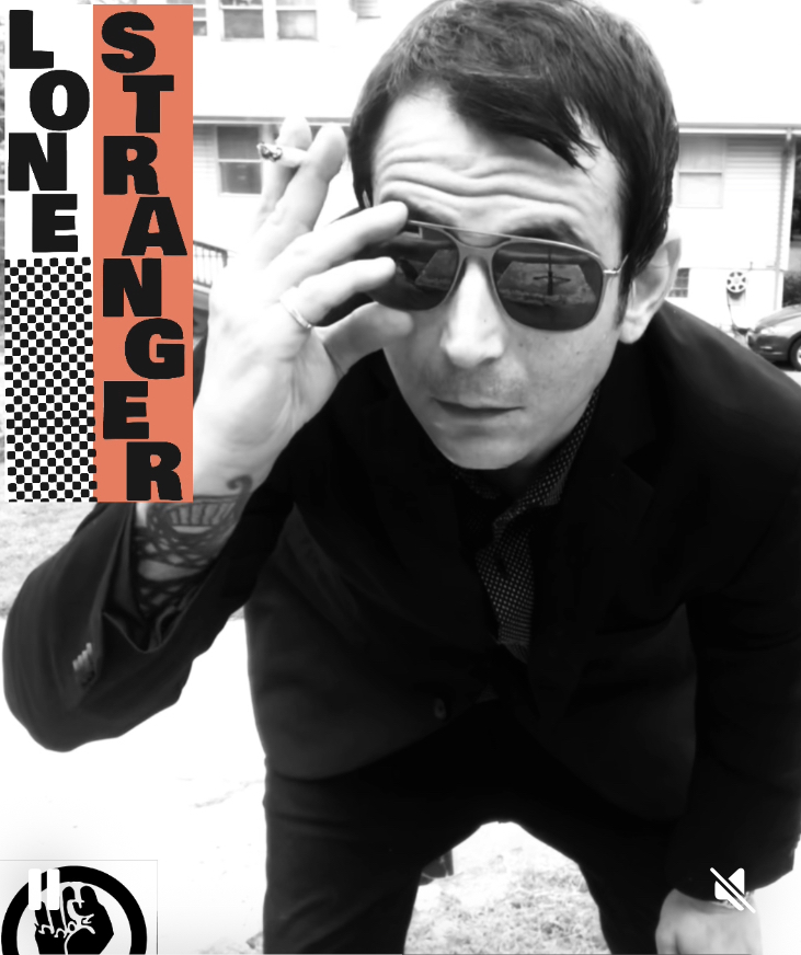 Man wearing sunglasses and a dark jacket, leaning forward outdoors, with text 'LONE STRANGER' on the left side.