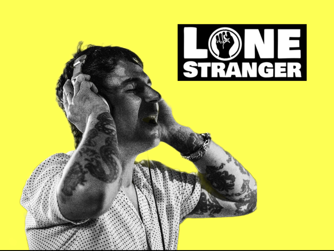 Black and white photo of a person with tattoos, holding their head, against a yellow background with a 'LONE STRANGER' logo.