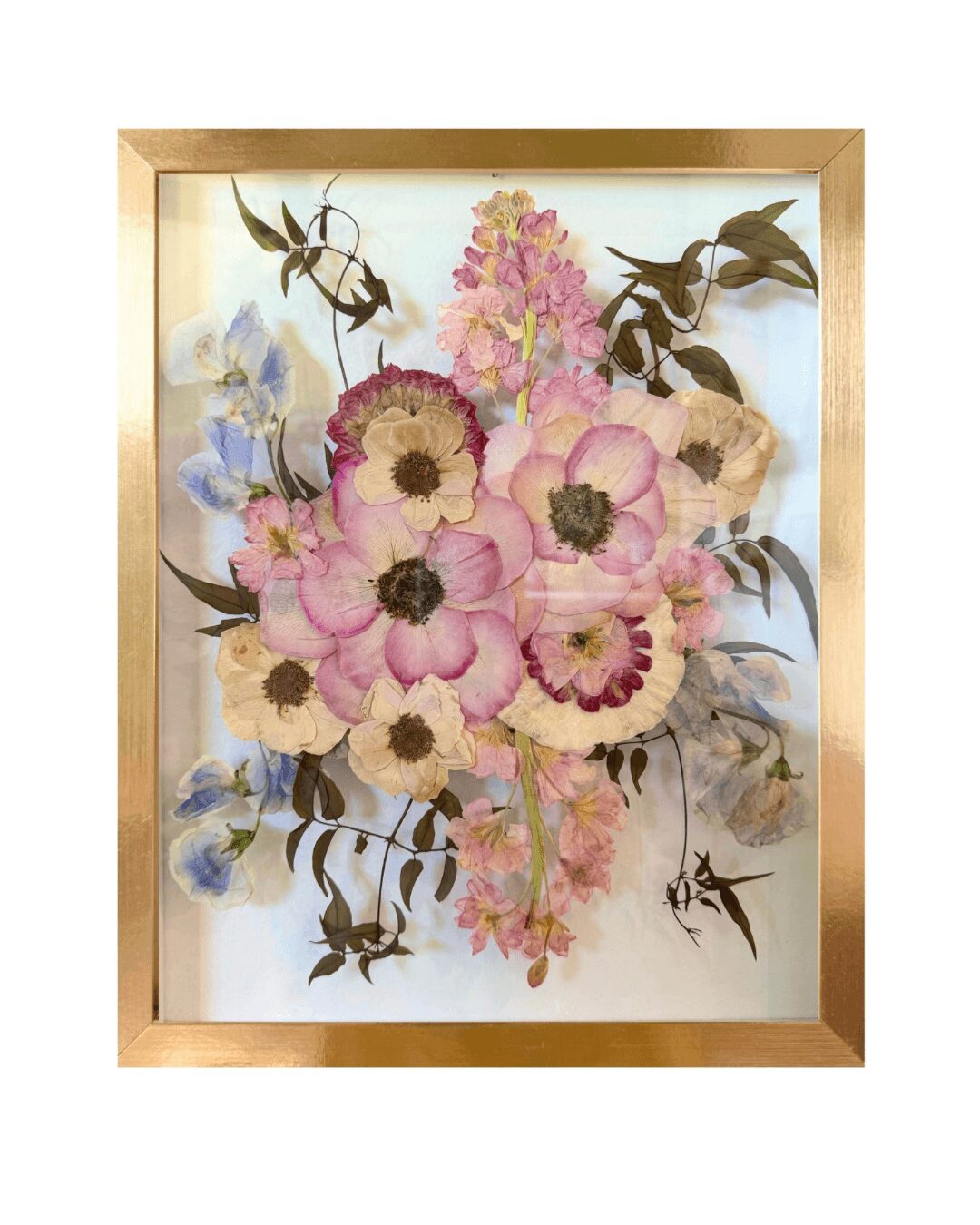 Watercolor floral painting with pink, purple, and cream flowers in a gold frame.