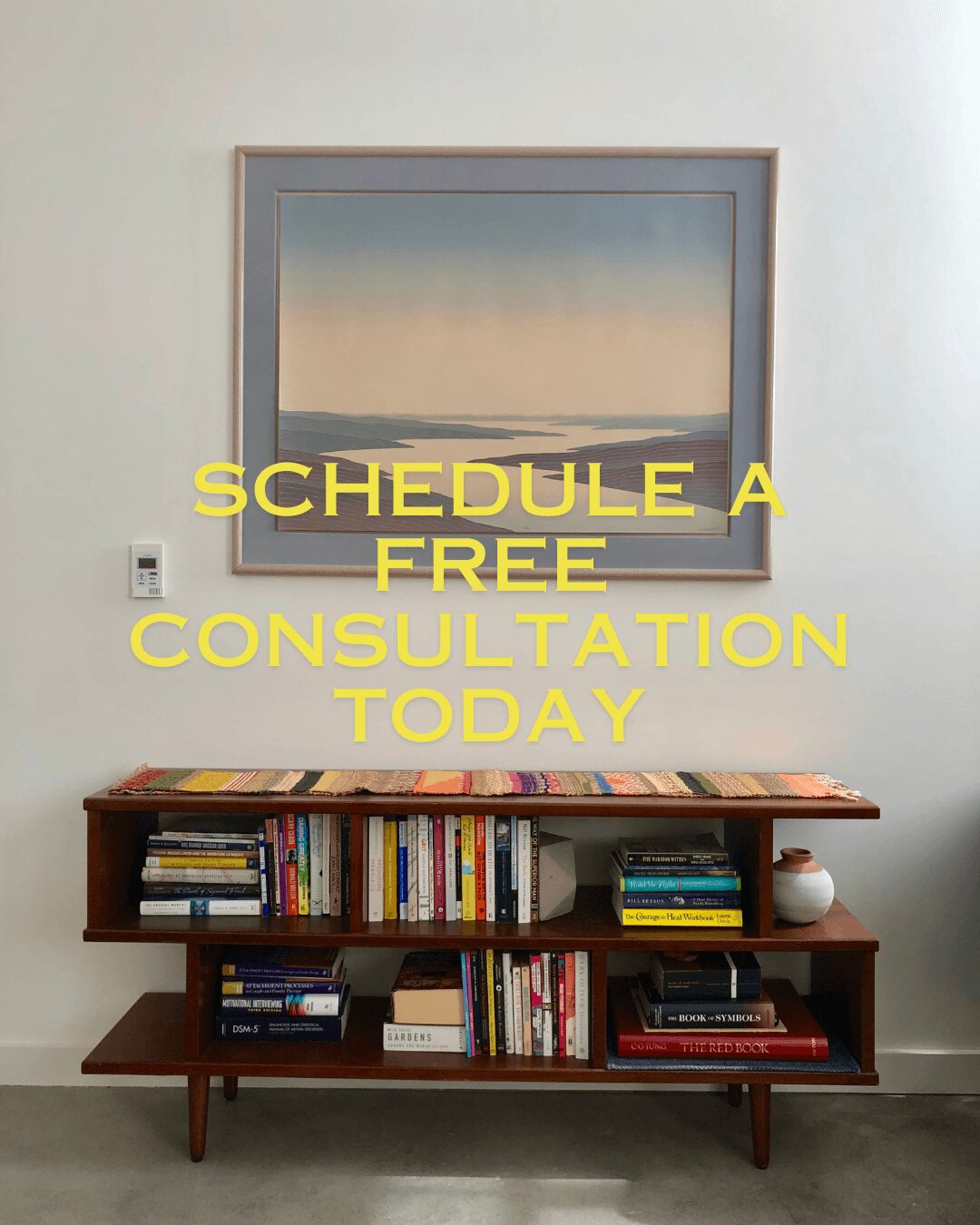 Bookshelf with books and a small decorative item, framed artwork above, and promotional text in yellow overlay.