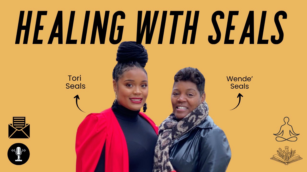 Two women smiling, one with a bun and red jacket, the other with short hair and scarf, with text about healing with seals.