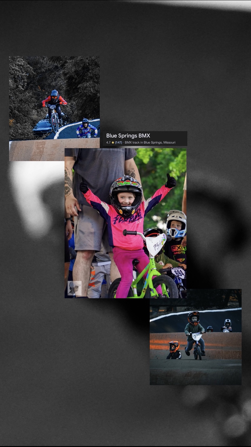 Child in pink riding a green bicycle with arms raised, wearing a helmet, surrounded by people and other bikes.