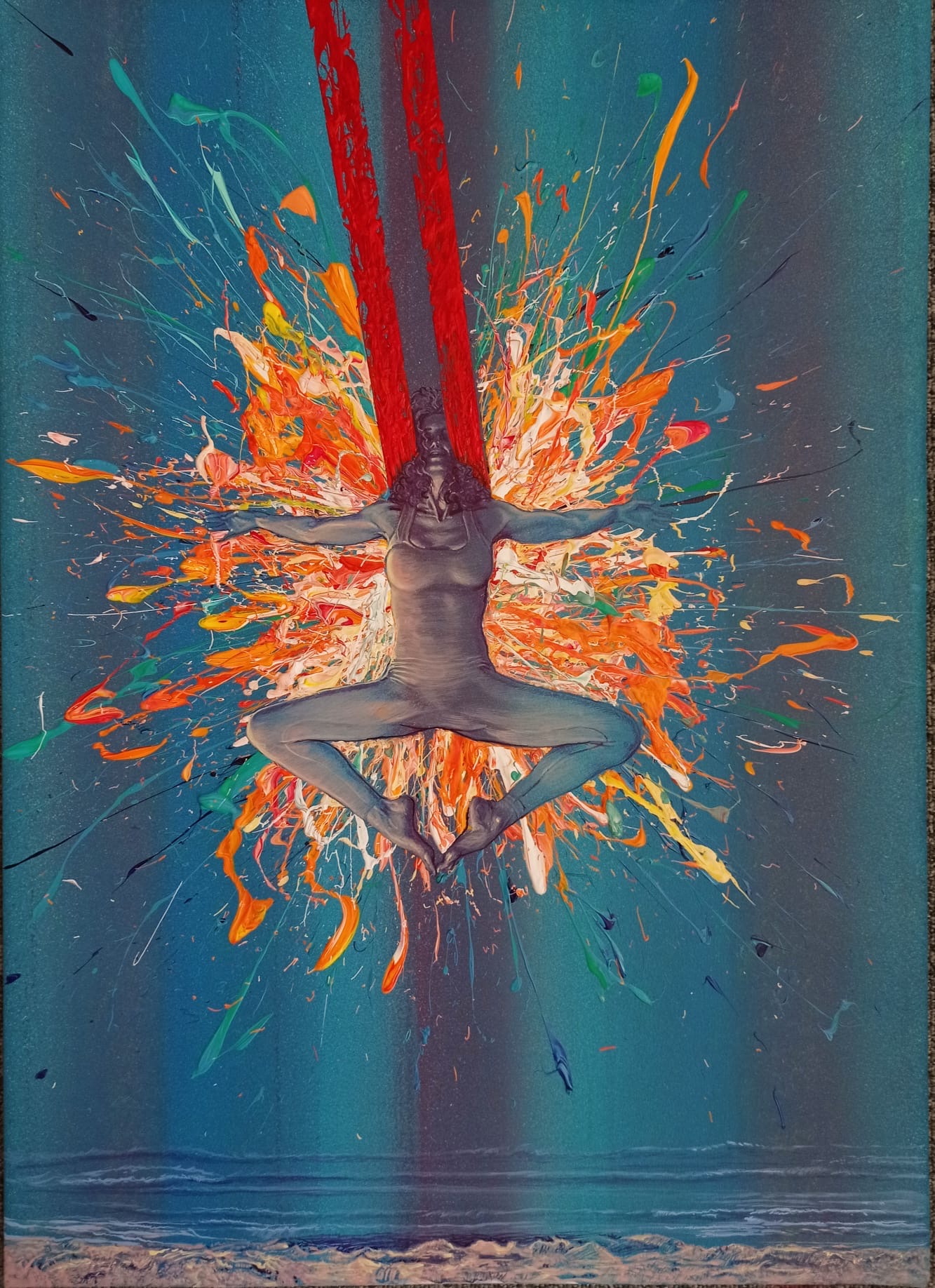 Person in a yoga pose with legs crossed and arms extended, surrounded by colorful paint splashes, against a blue background.