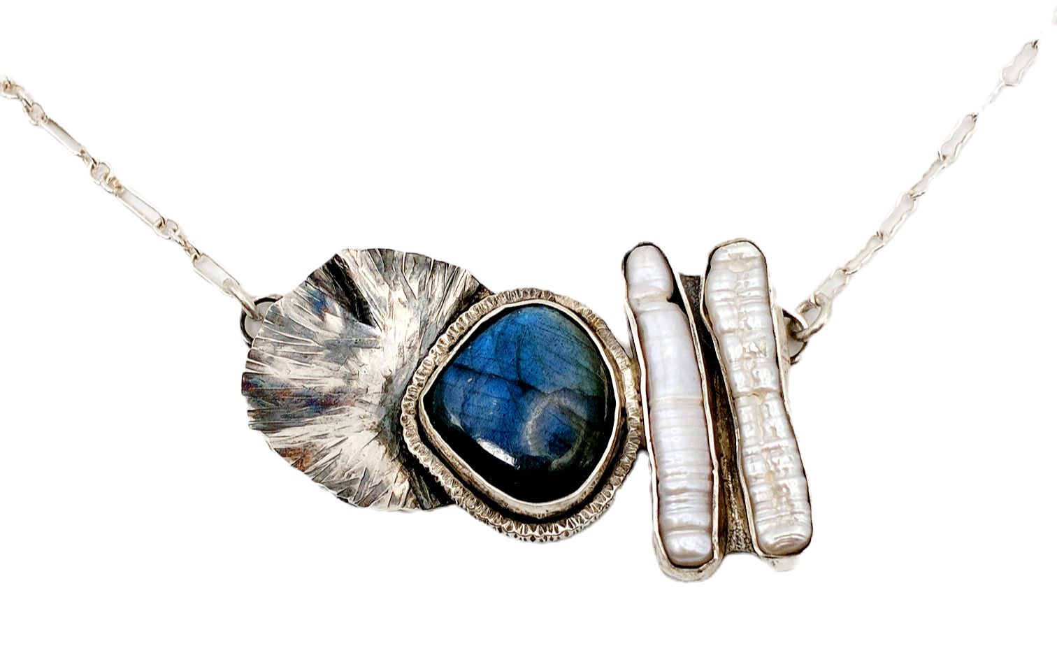 Necklace with large leaf, blue stone, and silver bar elements on a black background.