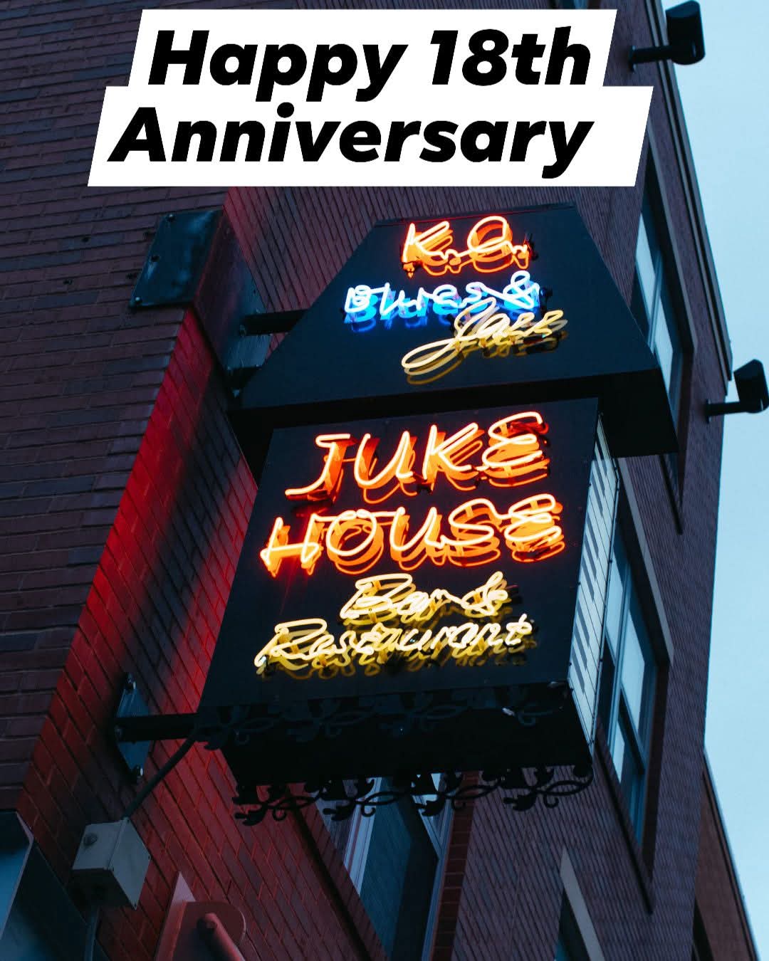 Neon sign for Juke House and Restaurant on building exterior, with overlay text celebrating 18th anniversary, 20 words.