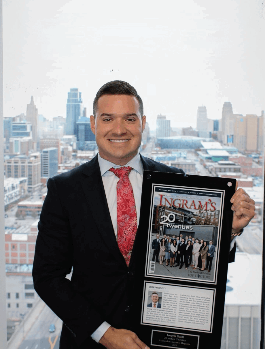 Man in suit holding framed collage with city skyline background, smiling, in a high-rise office.