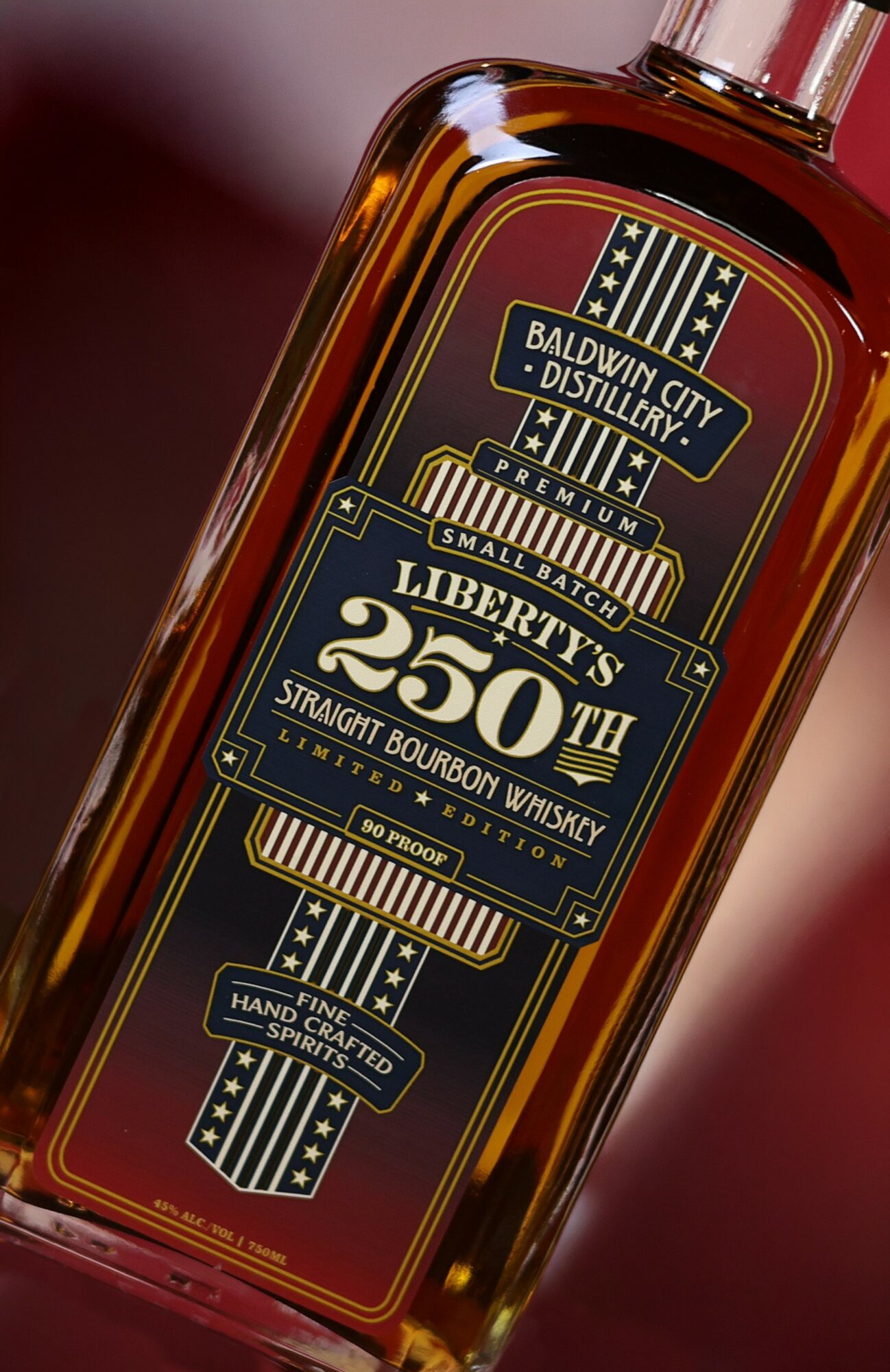Bottle of Liberty's 250th bourbon whiskey with a detailed label, tilted to the right, close-up view.