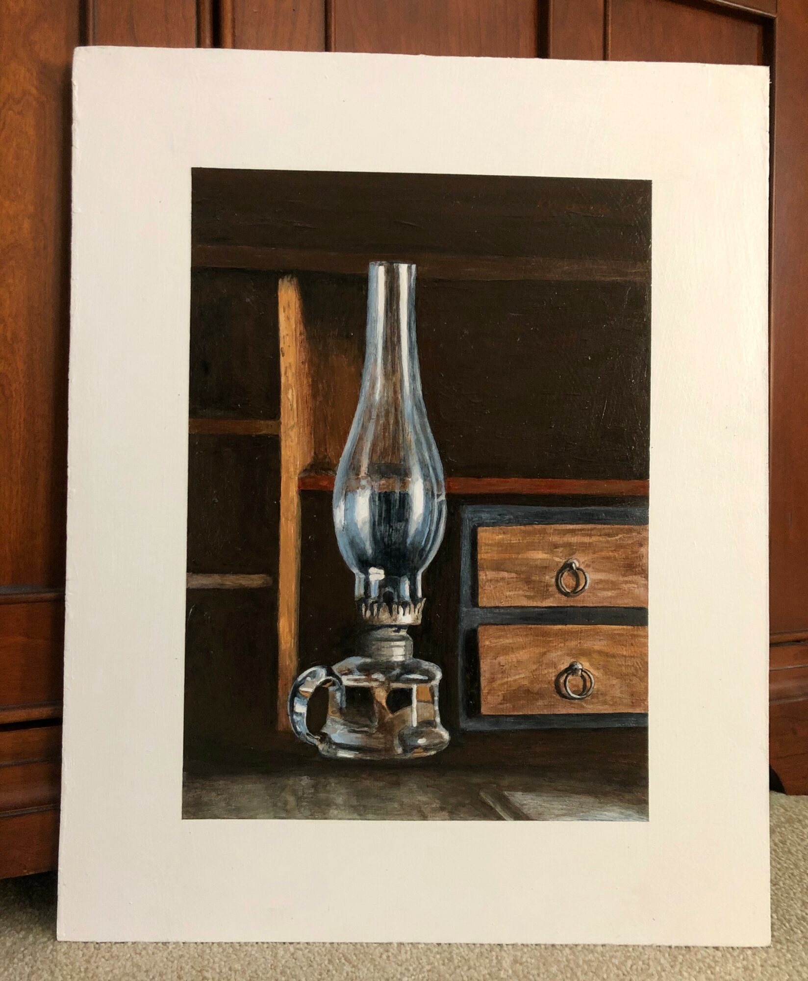 Oil painting of an antique oil lamp with a glass chimney, wooden furniture, and a dark background.