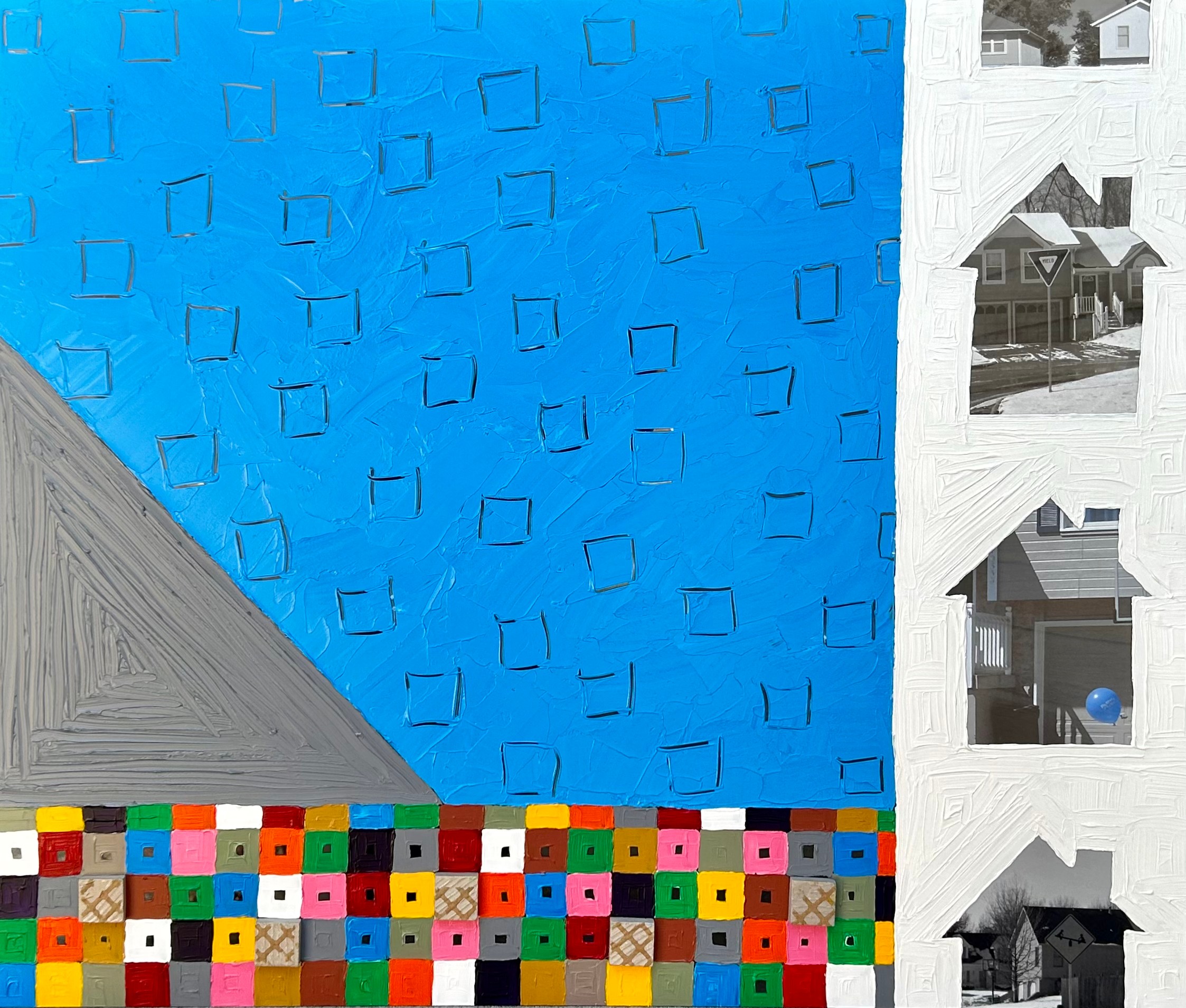 Colorful mosaic at bottom, blue wall with geometric pattern, white building with windows on right side.