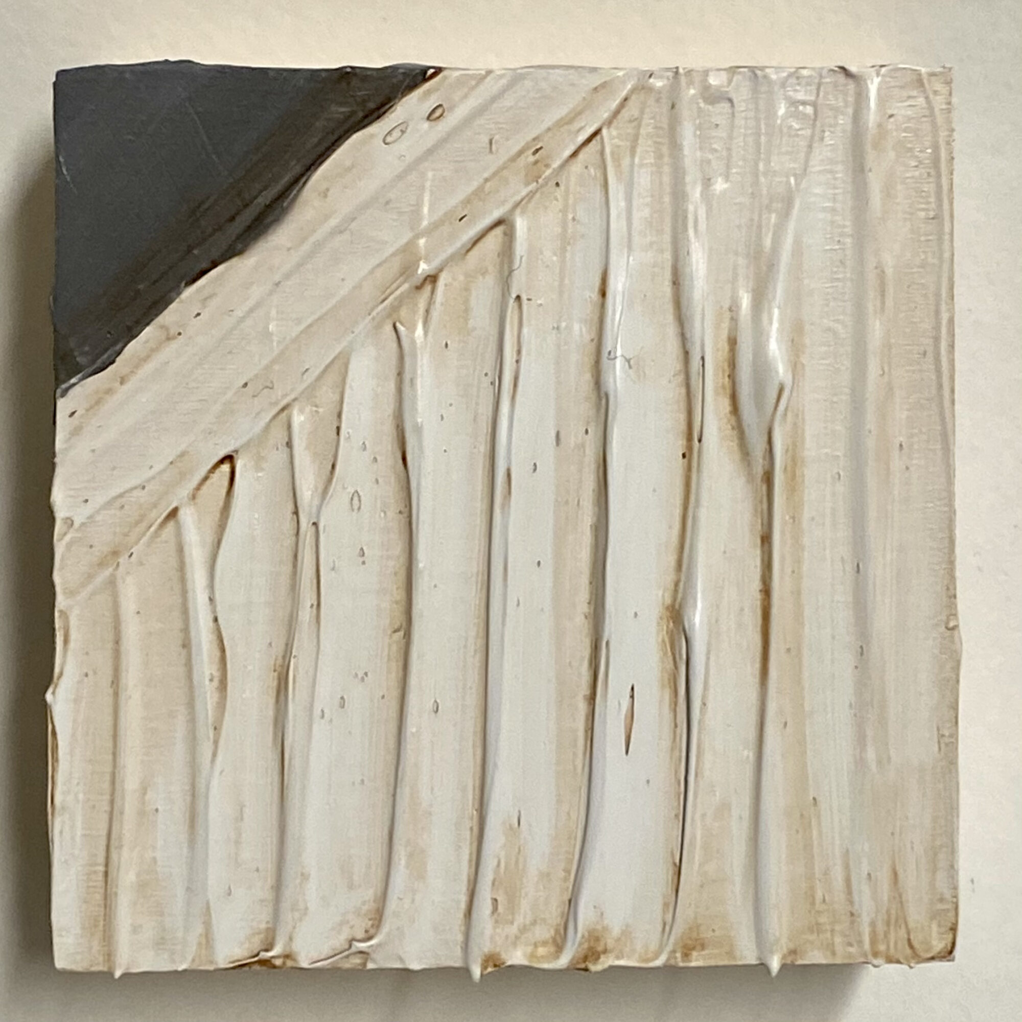 Square artwork with cream and brown textured surface, dark corner in top left, vertical ridges, and a diagonal dark section.