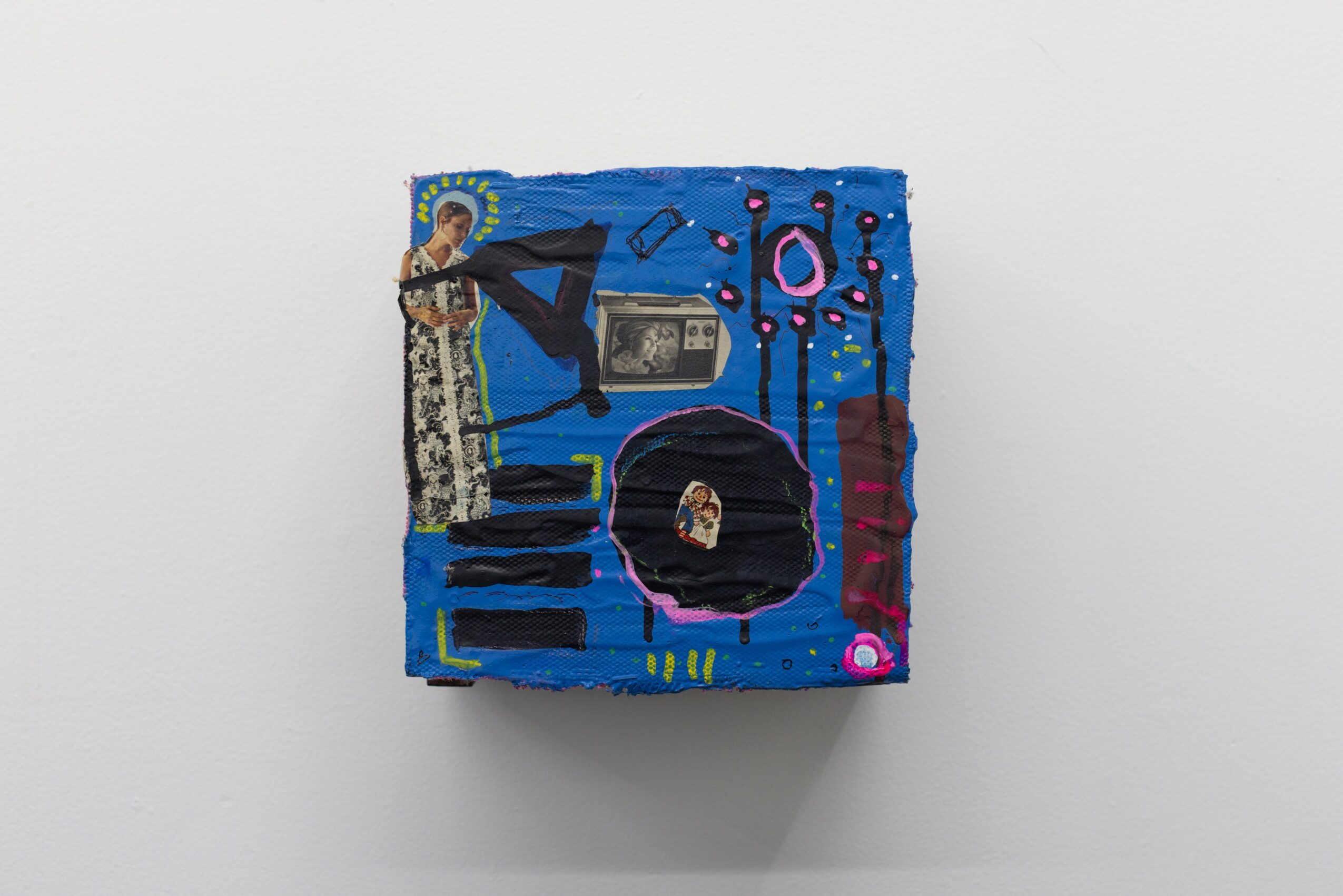 Small painted canvas with abstract shapes and objects, including a person, musical notes, and colorful patterns, on a white background.