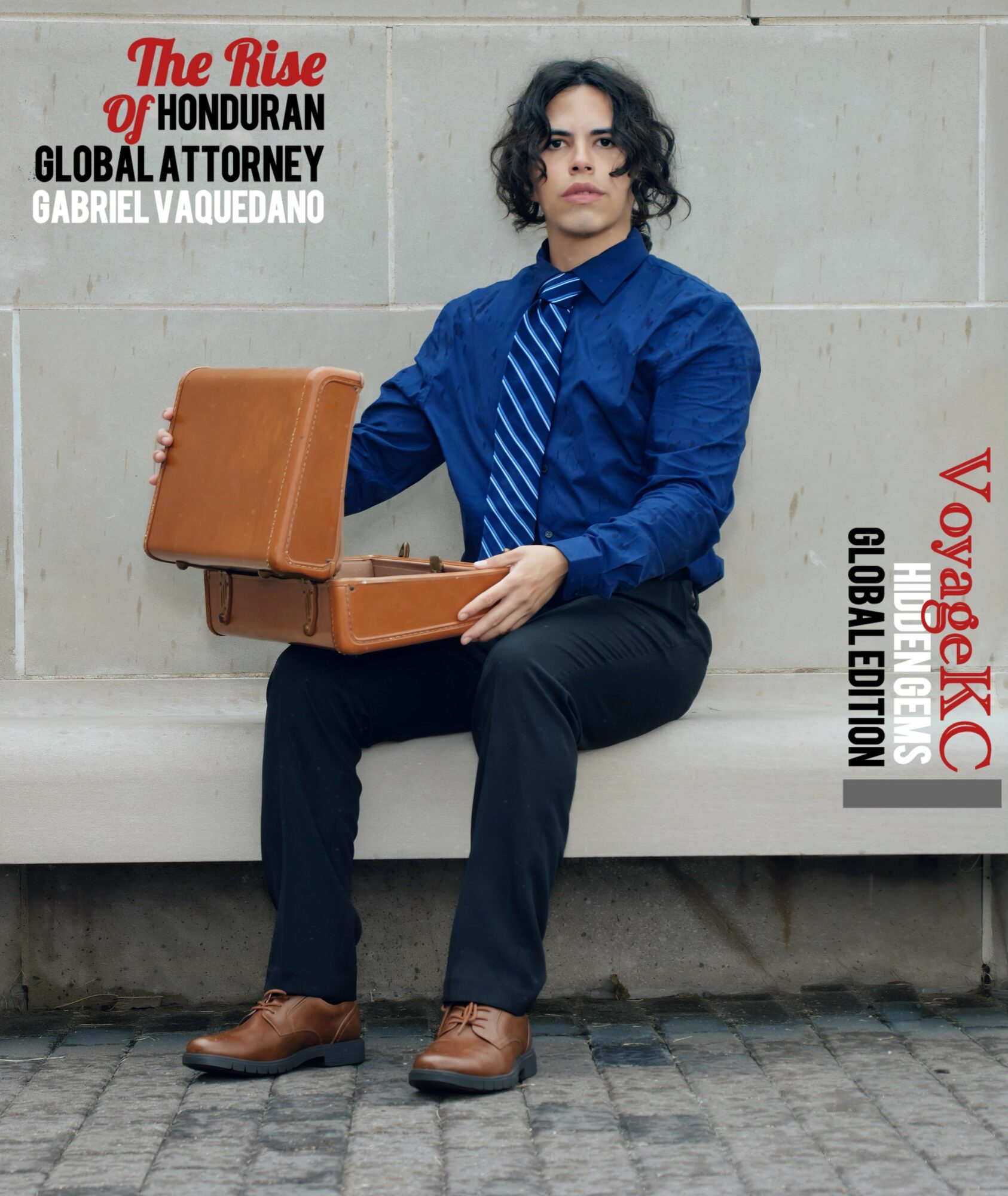 Person with curly hair in blue shirt and striped tie sitting on a bench holding an open briefcase.