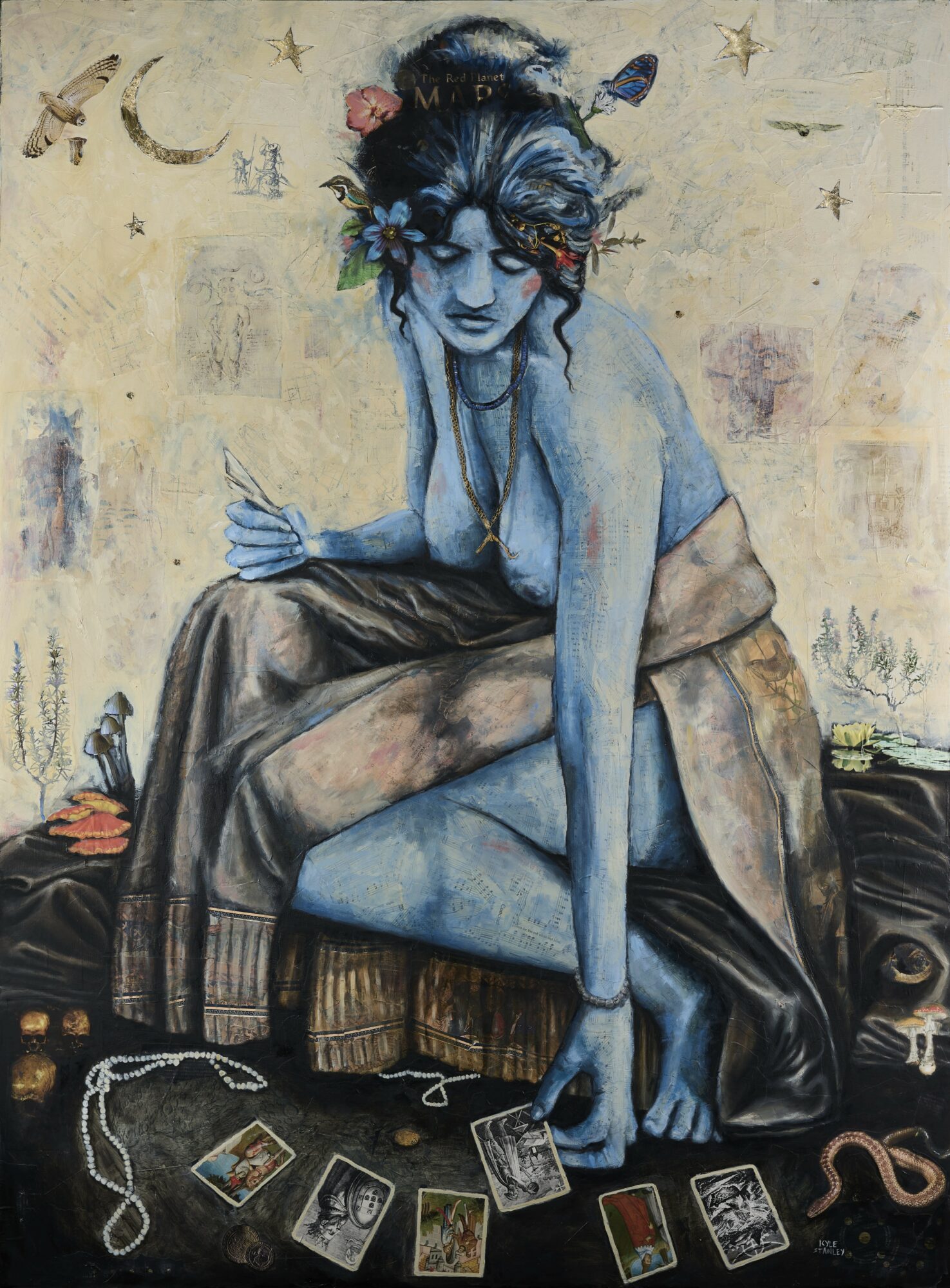 Blue-skinned woman with dark hair, sitting on a bed, surrounded by tarot cards and jewelry, with a dreamy expression.