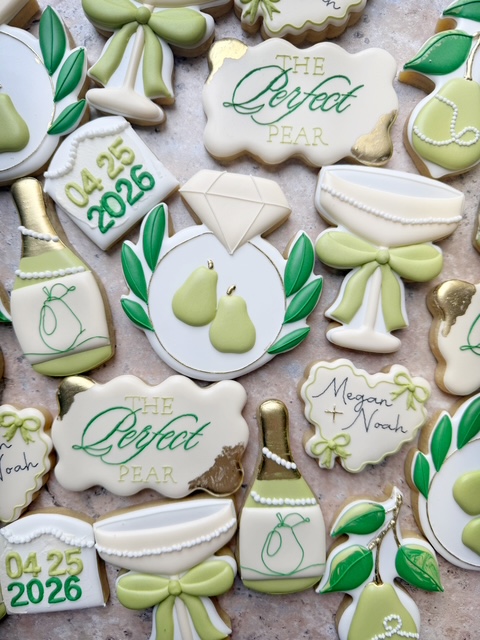Collection of decorated cookies with pear themes, bows, and text, in pastel green, white, and gold colors.