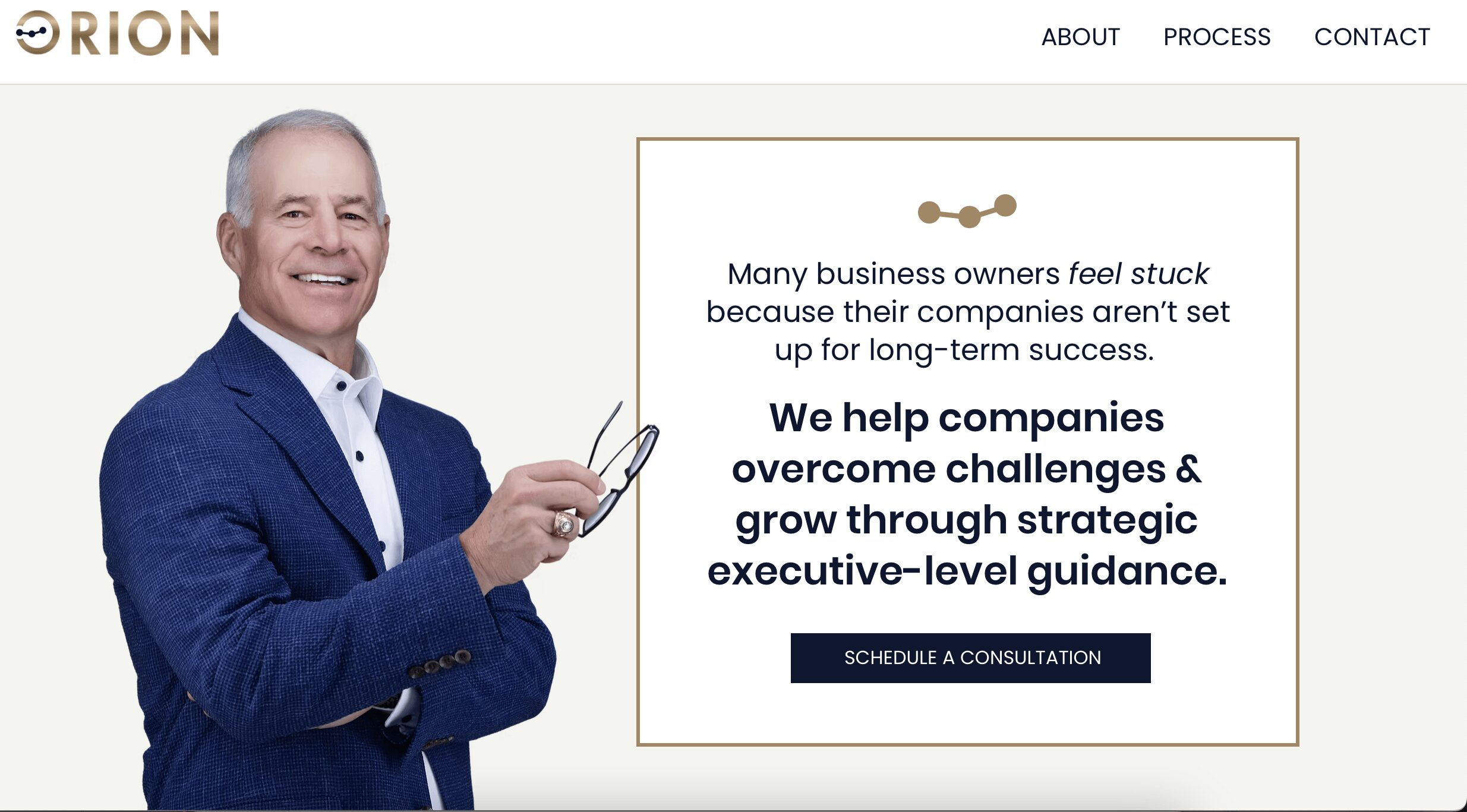 Man in a blue suit smiling, holding glasses, with text about business growth and strategic guidance, on a website homepage.