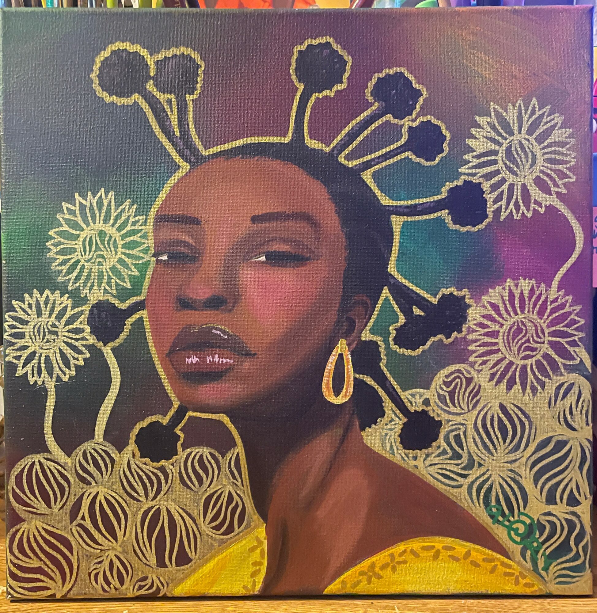 Portrait of a woman with styled hair, wearing a yellow garment and earring, surrounded by floral patterns.