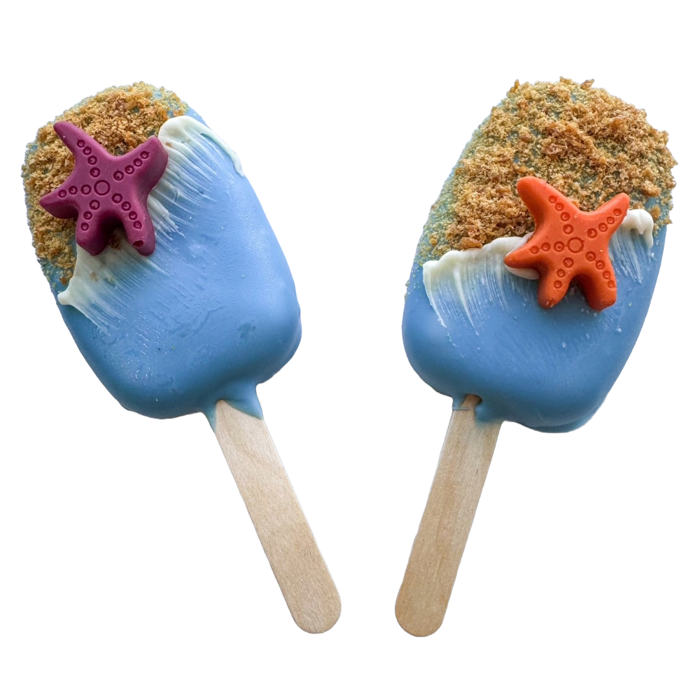 Two ice cream bars with blue coating, each topped with a starfish-shaped decoration, and coated with crumbs, on wooden sticks.
