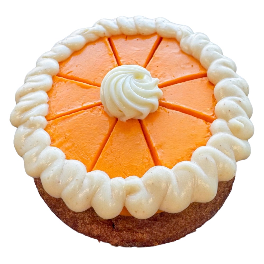 A round cake with orange topping, white cream border, and a central cream swirl, sliced into eight pieces.