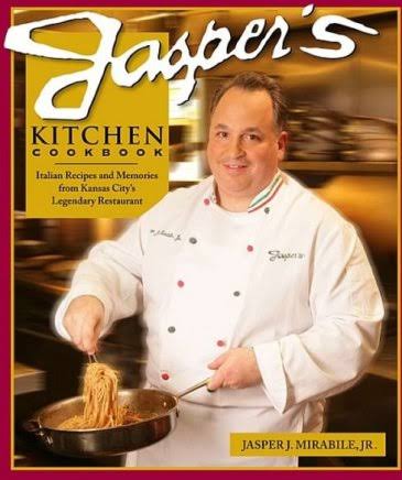 Chef in white coat holding a pan with noodles, smiling, kitchen background, Jasper's Kitchen Cookbook cover, author Jasper Mirabile Jr.