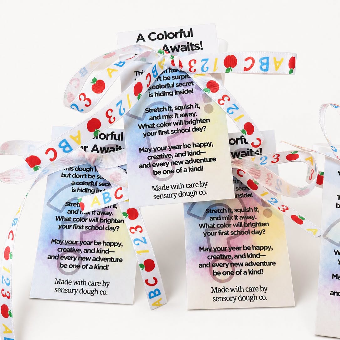Colorful paper strips with text and illustrations, arranged in a scattered pattern on a white background.