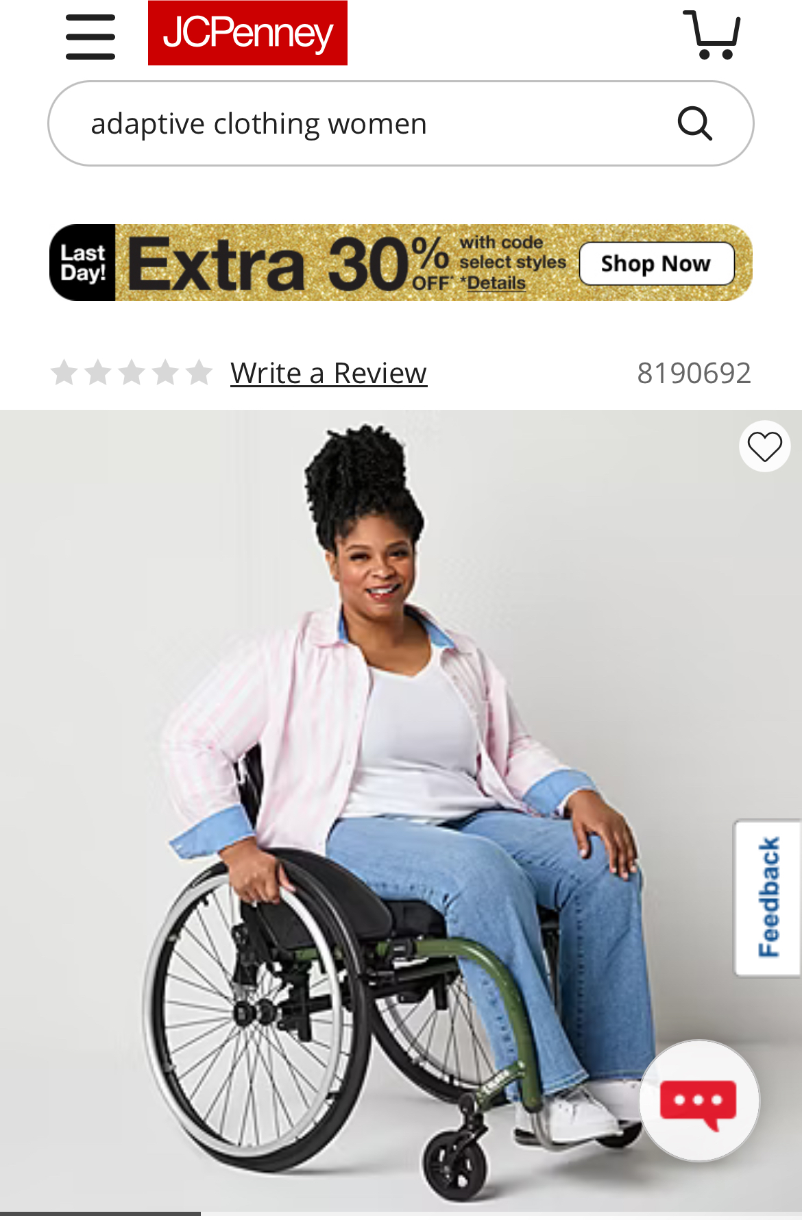 Woman in a wheelchair smiling, wearing a white jacket and blue jeans, sitting outdoors.