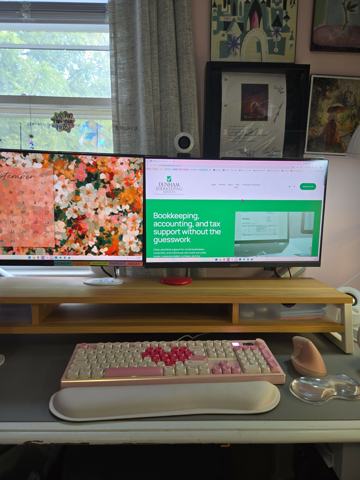 Computer monitor displaying a green and white message, keyboard with pink keys, and a mouse on a desk.