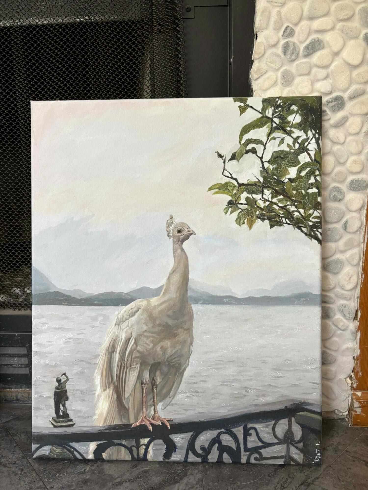 A painting of a swan on a lake with mountains in the background, a tree branch, and a person walking nearby.