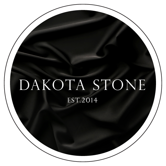 Black fabric background with white circular border and text reading 'Dakota Stone EST. 2014'.